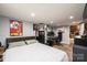 This stylish basement bedroom includes a workstation, bed, and decorative artwork at 444 27Th Avenue Nw Cir, Hickory, NC 28601