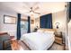 Cozy bedroom with neutral walls, a ceiling fan, and natural light from the window at 444 27Th Avenue Nw Cir, Hickory, NC 28601