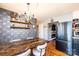 Dining room with a wooden table, modern wallpaper, and stainless steel refrigerator at 444 27Th Avenue Nw Cir, Hickory, NC 28601