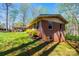 Side exterior view of the brick home with a covered carport and green lawn at 444 27Th Avenue Nw Cir, Hickory, NC 28601