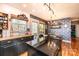 Contemporary kitchen features black cabinets, an island with a granite countertop, and a view of the backyard at 444 27Th Avenue Nw Cir, Hickory, NC 28601