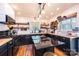 Modern kitchen with black cabinets, butcher block countertops, and stylish open shelving, perfect for culinary enthusiasts at 444 27Th Avenue Nw Cir, Hickory, NC 28601