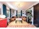 Inviting living room with a cozy sectional sofa, hardwood floors, and natural light streaming through the windows at 444 27Th Avenue Nw Cir, Hickory, NC 28601