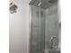Stylish shower featuring gray tile, glass doors, and modern fixtures for a luxurious experience at 444 27Th Avenue Nw Cir, Hickory, NC 28601