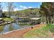 Lakeside property showcasing a dock and boathouse with picturesque water views at 458 Pinehaven Dr, Badin Lake, NC 28127