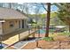 Stunning backyard with a wooden deck overlooking the serene lake and private dock at 458 Pinehaven Dr, Badin Lake, NC 28127
