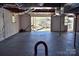 View from basement out to backyard with lake, dock, and boat house at 458 Pinehaven Dr, Badin Lake, NC 28127