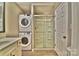 Bathroom featuring stackable washer/dryer, stand up shower and vanity at 458 Pinehaven Dr, Badin Lake, NC 28127