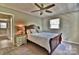 Bedroom with bedside table, ceiling fan and carpeted floors at 458 Pinehaven Dr, Badin Lake, NC 28127