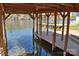 Covered boat slip on a serene lake, offering convenient water access at 458 Pinehaven Dr, Badin Lake, NC 28127