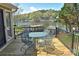 Outdoor deck with patio furniture providing a relaxing space to enjoy views of the serene lake and waterfront scenery at 458 Pinehaven Dr, Badin Lake, NC 28127