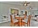 Cozy dining area featuring a round wooden table and comfortable chairs, bathed in natural light at 458 Pinehaven Dr, Badin Lake, NC 28127