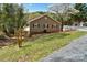 Landscaped property featuring an inviting lake house with natural light and charming details at 458 Pinehaven Dr, Badin Lake, NC 28127