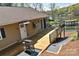 Charming home boasts an expansive deck with lake views, complemented by a private dock for serene waterfront living and relaxation at 458 Pinehaven Dr, Badin Lake, NC 28127