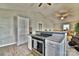 Open kitchen with stainless appliances, breakfast bar, and seamless flow to adjacent living spaces at 458 Pinehaven Dr, Badin Lake, NC 28127