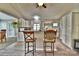Charming kitchen featuring white cabinets, stone countertops, and an open layout with bar seating at 458 Pinehaven Dr, Badin Lake, NC 28127