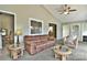 Inviting living room featuring a vaulted ceiling, comfortable seating, and bright natural light at 458 Pinehaven Dr, Badin Lake, NC 28127