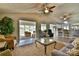 A spacious living room with wood floors has views to the lake, kitchen, and sitting room at 458 Pinehaven Dr, Badin Lake, NC 28127