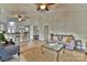An open concept living room and kitchen features wood floors, vaulted ceilings, and bar seating at 458 Pinehaven Dr, Badin Lake, NC 28127