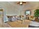The living room features wood floors, natural light, and comfortable seating options at 458 Pinehaven Dr, Badin Lake, NC 28127