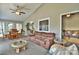 Cozy living room with neutral tones and a view into other living spaces with windows to let light in and provide a nice view at 458 Pinehaven Dr, Badin Lake, NC 28127