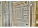 Clean bathroom with shower/tub combo, tiled walls, and recessed shelves at 458 Pinehaven Dr, Badin Lake, NC 28127