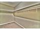 Spacious walk-in closet provides ample storage with shelves and carpeted flooring at 458 Pinehaven Dr, Badin Lake, NC 28127