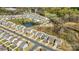 Aerial view of a neighborhood showcasing houses and a pond at 5104 Thomasville Dr, Belmont, NC 28012