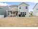 Expansive backyard with a covered patio and ample space for outdoor activities at 5104 Thomasville Dr, Belmont, NC 28012