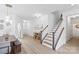 Inviting entryway with hardwood floors, modern lighting, and a staircase leading to the upper level at 5104 Thomasville Dr, Belmont, NC 28012