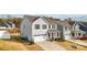 Well-maintained home featuring gray siding, a two-car garage, and manicured landscaping at 5104 Thomasville Dr, Belmont, NC 28012