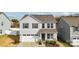Well-maintained home featuring gray siding, a two-car garage, and manicured landscaping at 5104 Thomasville Dr, Belmont, NC 28012