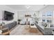 Bright and spacious living room featuring stylish furniture, large windows, and modern decor at 5104 Thomasville Dr, Belmont, NC 28012