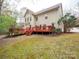 A spacious deck overlooks a backyard with green space, perfect for relaxation at 6108 Mcilwaine Rd, Huntersville, NC 28078