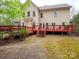 A spacious deck overlooks a backyard with green space, perfect for relaxation at 6108 Mcilwaine Rd, Huntersville, NC 28078