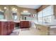 Bright bathroom with double vanities, garden tub, walk-in shower, and a large window adding luxury to the space at 6108 Mcilwaine Rd, Huntersville, NC 28078
