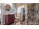 Bathroom featuring a glass enclosed tiled shower, and a vanity offering functionality and style at 6108 Mcilwaine Rd, Huntersville, NC 28078