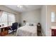 Bright bedroom with work space, carpet floors, and natural light at 6108 Mcilwaine Rd, Huntersville, NC 28078