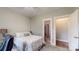 Cozy bedroom with soft carpet, neutral walls, and an ensuite bathroom providing a comfortable retreat at 6108 Mcilwaine Rd, Huntersville, NC 28078