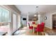 Dining area with view to the deck, living room, and kitchen at 6108 Mcilwaine Rd, Huntersville, NC 28078