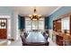 Charming dining room with large windows, a stylish table, and storage at 6108 Mcilwaine Rd, Huntersville, NC 28078