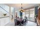 Open dining room features large windows, and stylish lighting at 6108 Mcilwaine Rd, Huntersville, NC 28078