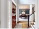 Bright foyer featuring hardwood floors, a dining area, stairs, and a decorative front door at 6108 Mcilwaine Rd, Huntersville, NC 28078