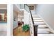 Elegant foyer with hardwood floors, staircase, and a glimpse into the inviting living room at 6108 Mcilwaine Rd, Huntersville, NC 28078
