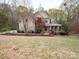 Charming two-story home with lush front lawn and inviting covered porch at 6108 Mcilwaine Rd, Huntersville, NC 28078