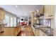 Open concept kitchen with granite island and view into dining area at 6108 Mcilwaine Rd, Huntersville, NC 28078