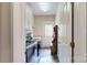 Laundry room with sink, washer/dryer, and access to the backyard at 6108 Mcilwaine Rd, Huntersville, NC 28078