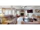 Relaxing living room with a fireplace, comfortable couches, and hardwood floors at 6108 Mcilwaine Rd, Huntersville, NC 28078