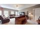 Entertainment space features a built-in bar, leather seating, and neutral tones for a relaxed atmosphere at 6108 Mcilwaine Rd, Huntersville, NC 28078