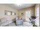 Well-lit home office with a cozy chair, desk, and large window for a bright workspace at 6108 Mcilwaine Rd, Huntersville, NC 28078